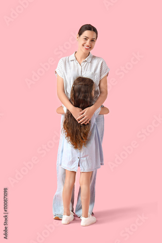 Embracing little girl with ...
