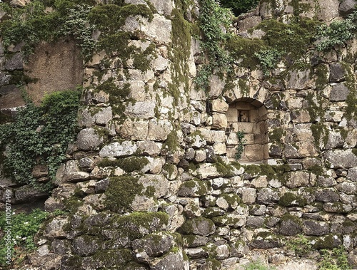 Weathered stonework surrounded by moss and lichen, natural, stonework, moss, weathered, ancient photo