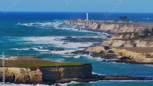 Point Arena Lighthouse Racas Sea Lion Rocks Cove California aerial drone Stornetta coastal Trail Mendocino coast scenic vista point sunny daytime morning afternoon blue sky waves nature upwards motion photo