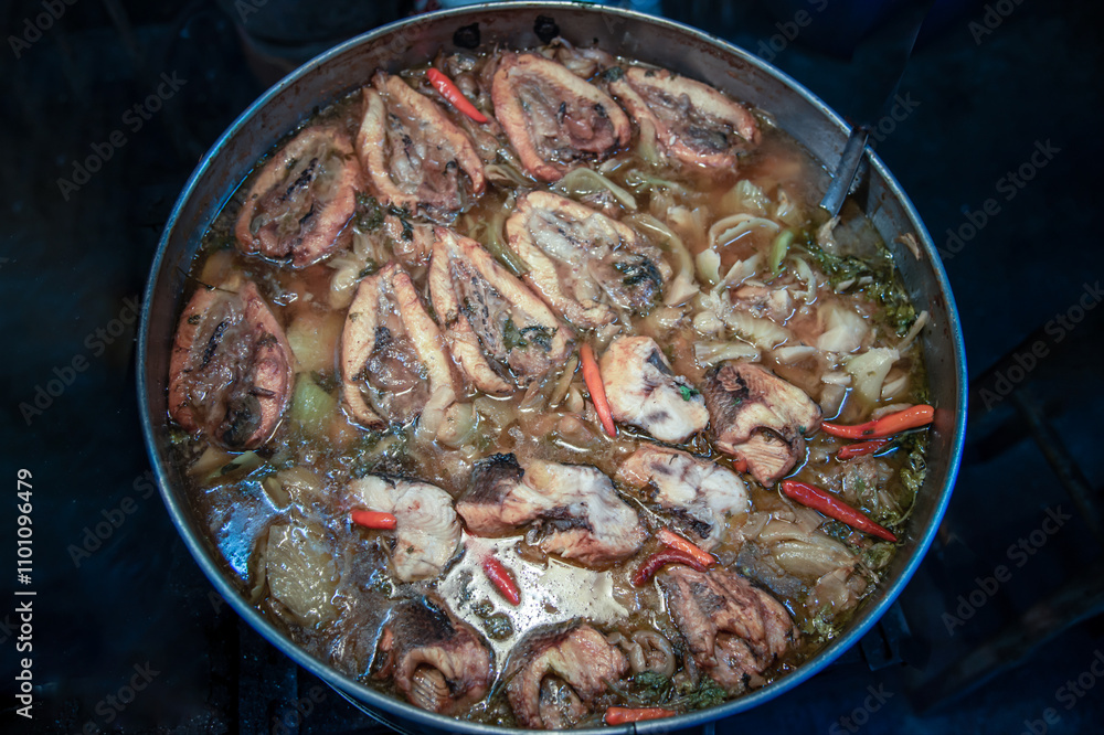 Snake head fish belly with pickle mustard soup. Chinese style. Oblique view from the top, Selective focus.