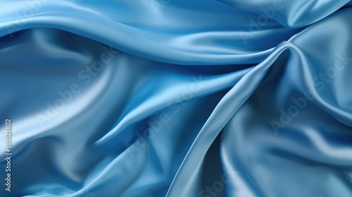 Luxurious blue silk satin fabric texture with elegant folds and smooth sheen for background or textile design.