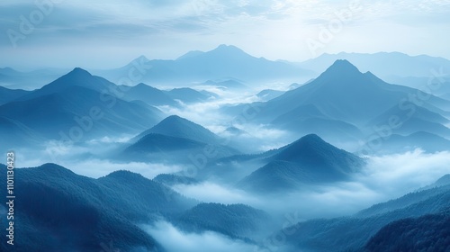 Wispy clouds weave through distant mountain peaks, creating a mystical atmosphere.