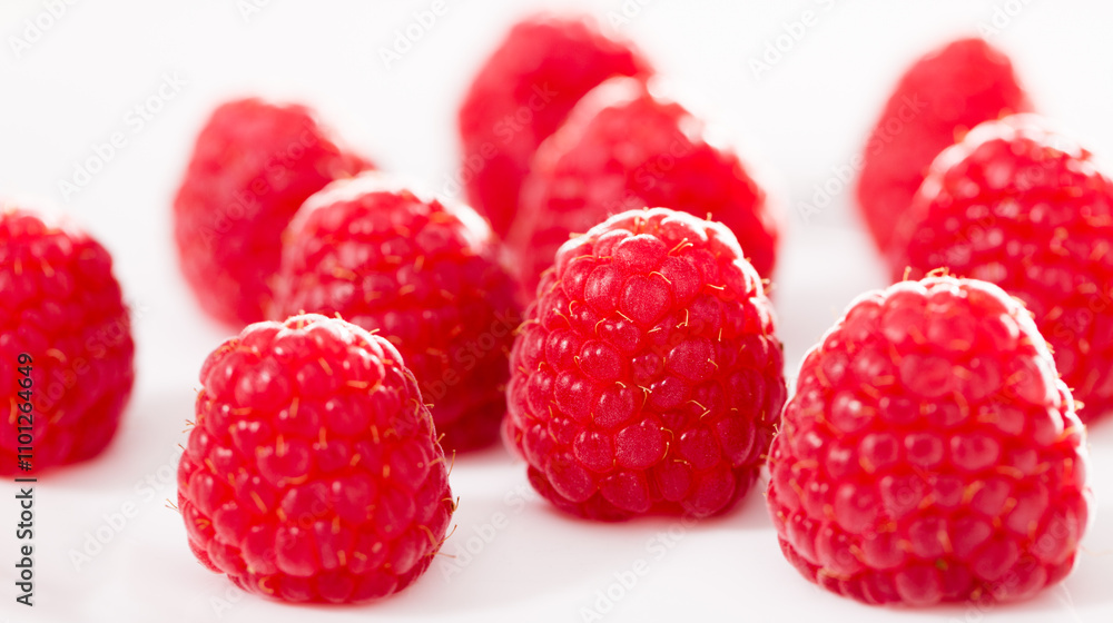Handful of raspberry berries on white background Handful of raspberry berries on white background