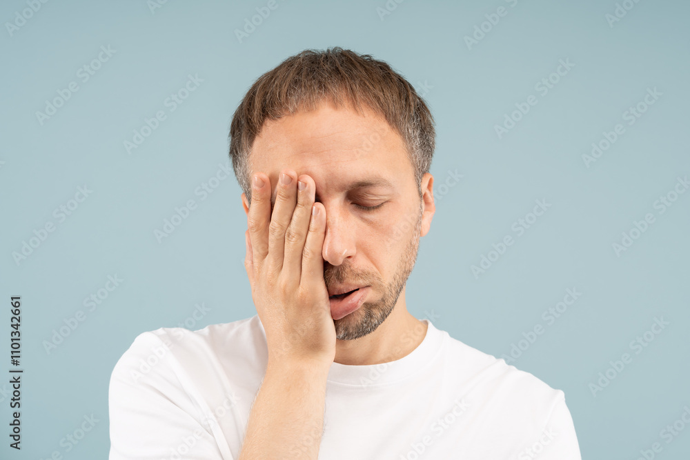 Man with exhaustion looks fatigued, unmotivated. Chronic fatigue by depression, sleep apnea, viral infections, autoimmune diseases, mental strain. Tired male feels burnout, need psychological help. Man with exhaustion looks fatigued, unmotivated. Chronic fatigue by depression, sleep apnea, viral infections, autoimmune diseases, mental strain. Tired male feels burnout, need psychological help.