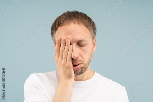 Fotografie Man with exhaustion looks fatigued, unmotivated