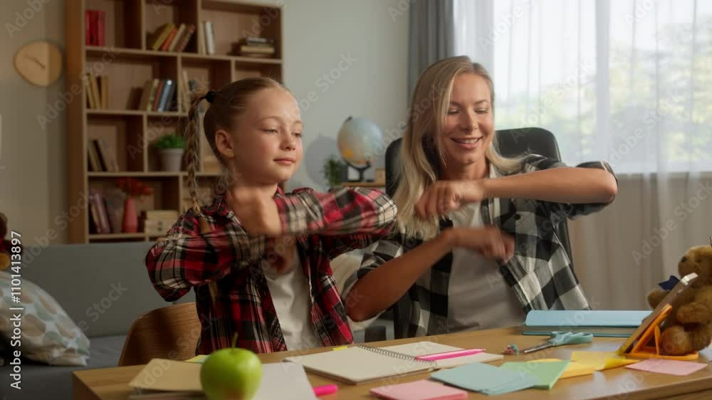 Cheerful Caucasian mother woman parent dancing with kid girl schoolgirl ...