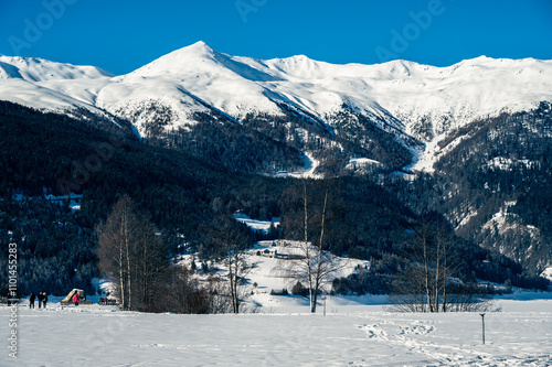 Bell tower of the ancient disappeared village of Curon. Lake Resia in winter. photo