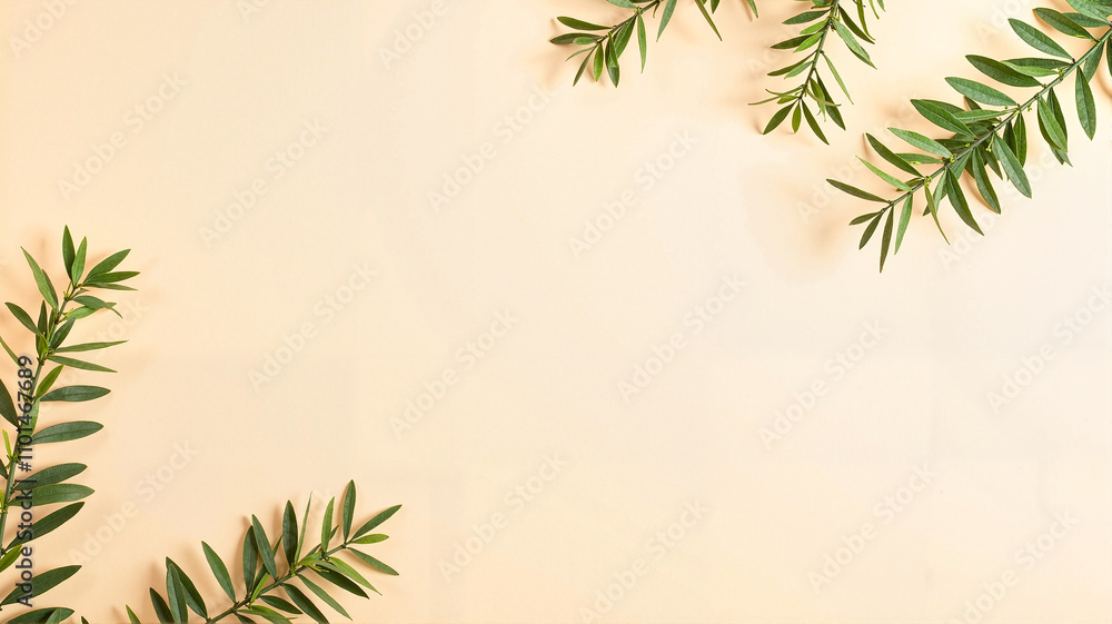 Green foliage on a soft cream background Green foliage on a soft cream background