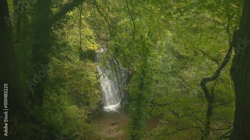 high-angle shot of the falling foss waterfall during autumn in North Yorkshire photo