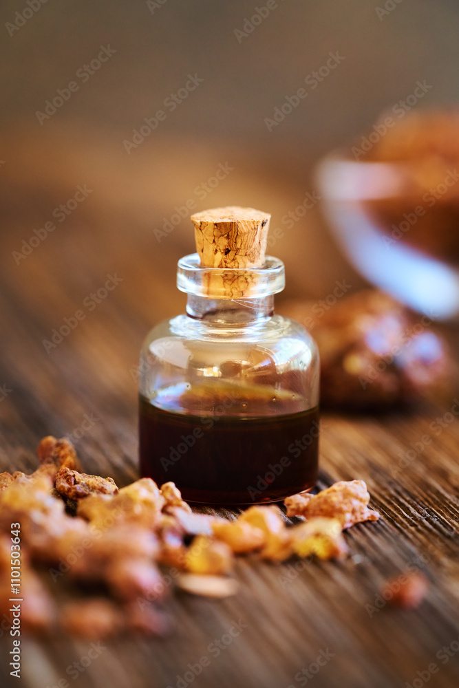 Myrrh essential oil in a bottle with myrrh resin Myrrh essential oil in a bottle with myrrh resin