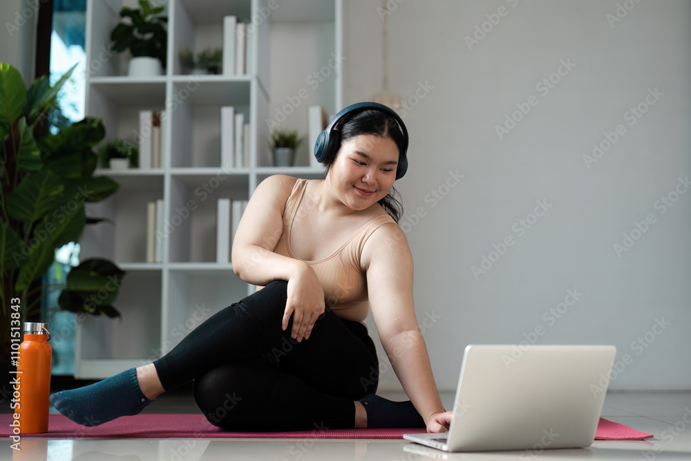 Obraz premium Overweight Woman Engaging in Online Wellness Class at Home for a Healthy Lifestyle