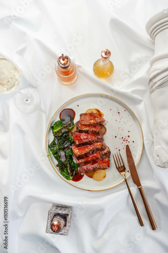 Beef Steak with Confit Potatoes and Spinach