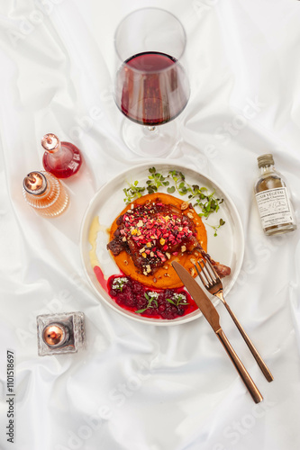 Duck Confit with Carrot Cream, Cranberry Sauce, and Hazelnut Praline