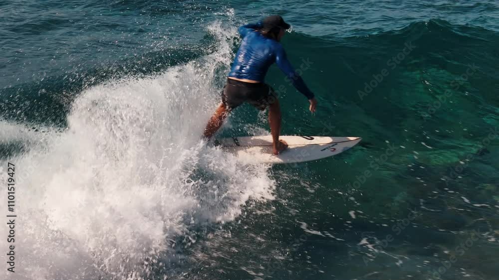 Surfer rides the wave in the Maldives and tries to do aerial Surfer rides the wave in the Maldives and tries to do aerial