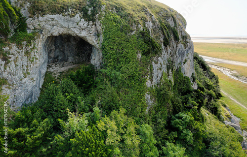 Obraz na płótnie Fairy Chapel Cave on west side of Humphrey Head limestone outcrop. View SE over tidal mudflats of Morecombe Bay Morecombe Sands. Prehistoric site w salonie