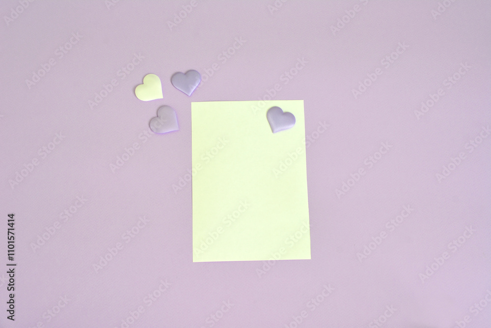 a lilac background with white paper with hearts on it a lilac background with white paper with hearts on it