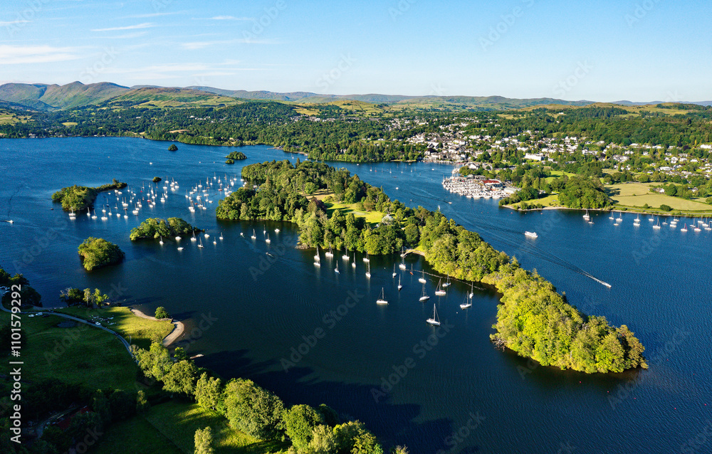 Windermere in the Lake District National Park, Cumbria, England. Aerial vista N.E. over lake centre at Bowness marinas and Belle Isle. Summer evening