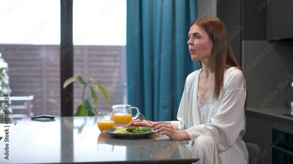 A peaceful and serene morning scene depicts a woman enjoying a healthy breakfast along with fresh juice A peaceful and serene morning scene depicts a woman enjoying a healthy breakfast along with fresh juice