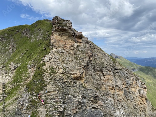 Rocky alpine peaks above Lake Melchsee or Melch Lake in the Uri Alps mountain massif, Kerns - Canton of Obwald, Switzerland (Kanton Obwalden, Schweiz) photo