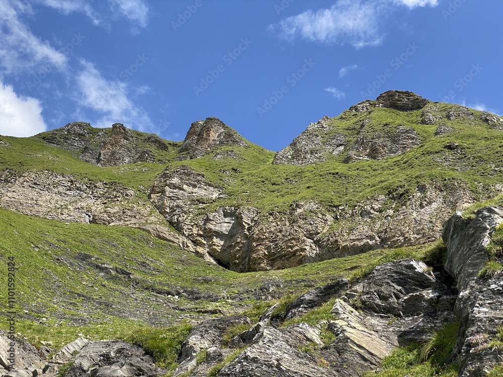 Rocky alpine peaks above Lake Melchsee or Melch Lake in the Uri Alps mountain massif, Kerns - Canton of Obwald, Switzerland (Kanton Obwalden, Schweiz) Rocky alpine peaks above Lake Melchsee or Melch Lake in the Uri Alps mountain massif, Kerns - Canton of Obwald, Switzerland (Kanton Obwalden, Schweiz)