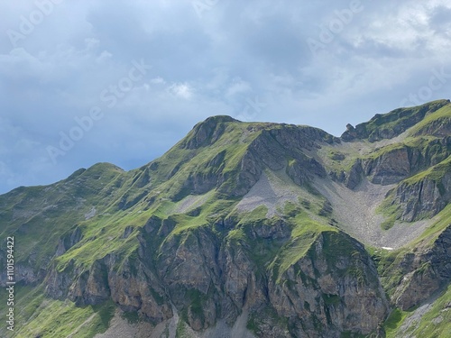 Rocky alpine peaks above Lake Melchsee or Melch Lake in the Uri Alps mountain massif, Kerns - Canton of Obwald, Switzerland (Kanton Obwalden, Schweiz) photo