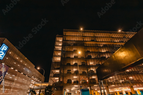 Multi story car park at the Sydney Domestic Airport illuminated at night photo