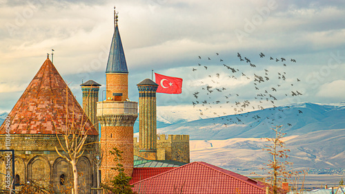 Historic Twin Minaret Madrasa with Turkish flag and majestic minarets in Erzurum