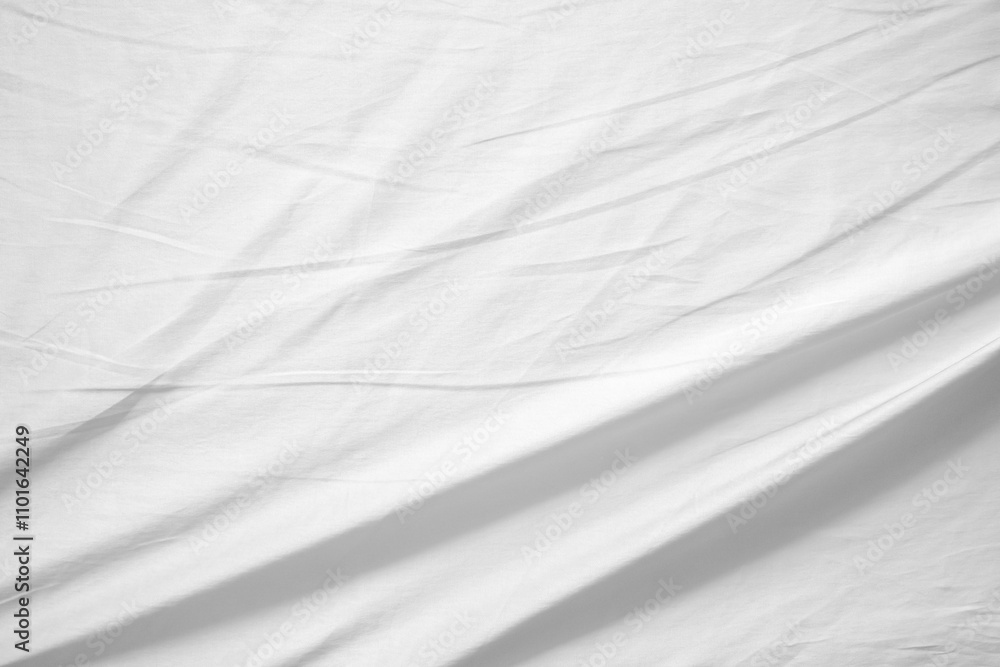 Fototapeta premium Abstract white wrinkled bedding sheet fabric texture background