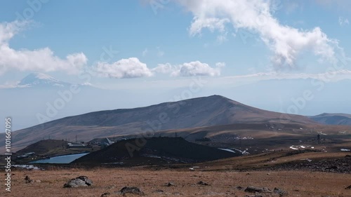 Mountain village near lake Kari nearby Mount Aragats, Armenia. Mount Ararat is in the background