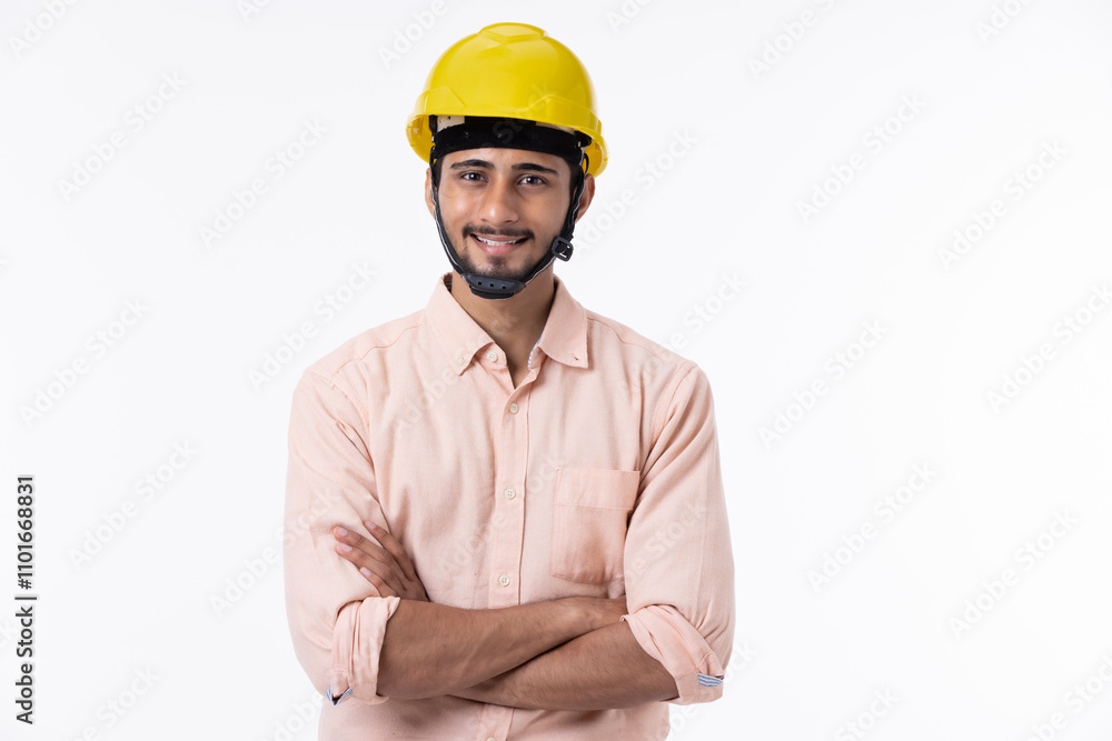 Studio portrait of a handsome construction worker with arms folded on white background Studio portrait of a handsome construction worker with arms folded on white background