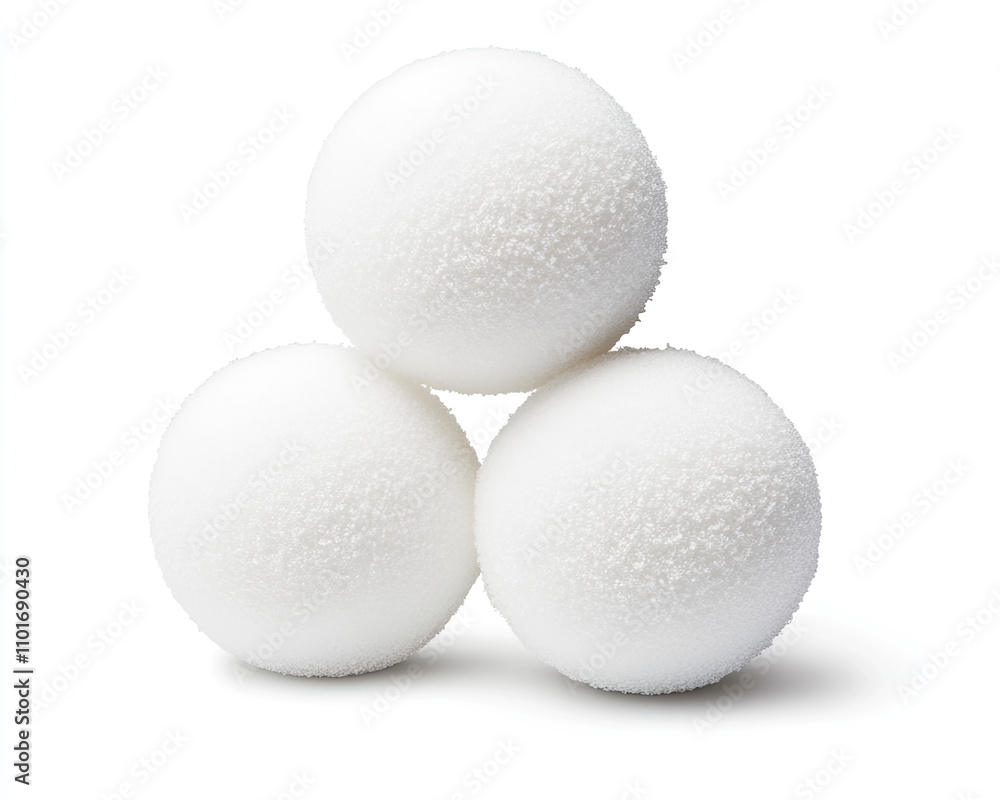 Three white spherical items stacked together on a clean background. Three white spherical items stacked together on a clean background.