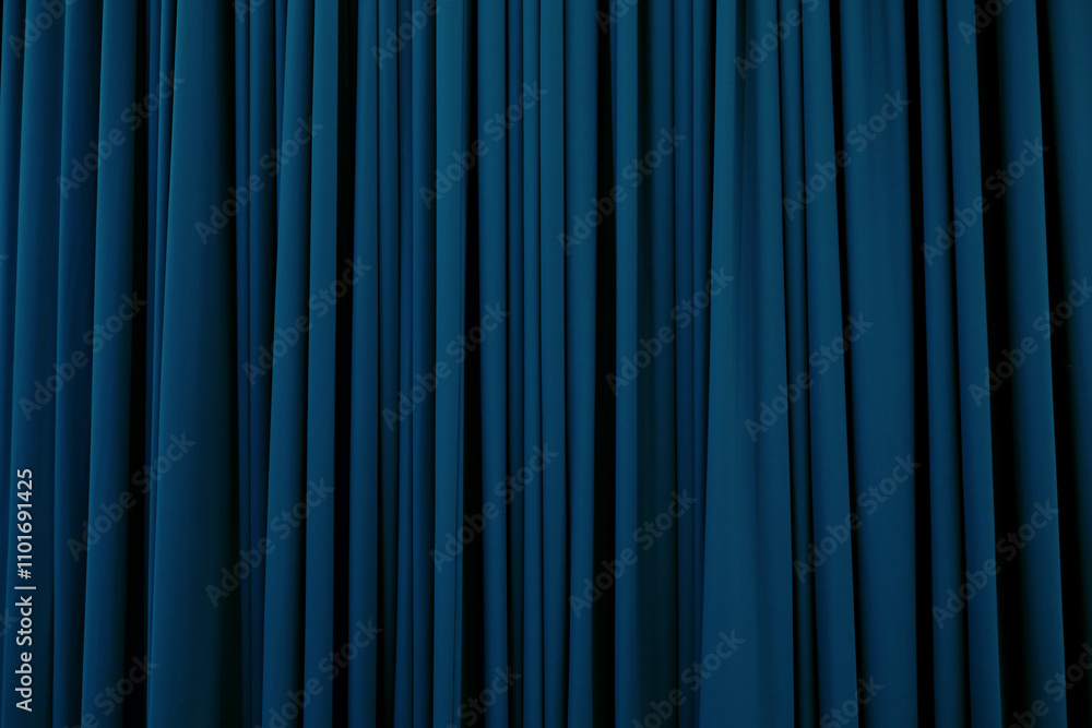 Light blue curtain with many folds background texture Light blue curtain with many folds background texture