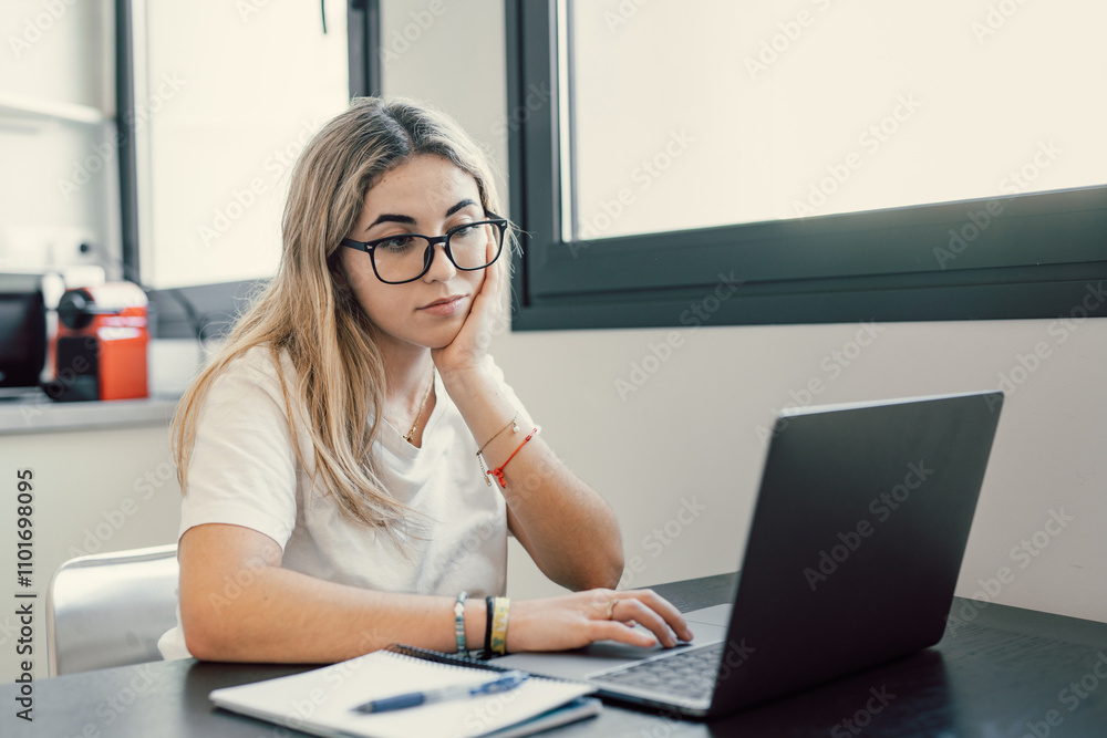Happy young blonde business woman entrepreneur using computer looking at screen working in internet sit at office desk, smiling millennial female professional employee typing email on laptop workplace Happy young blonde business woman entrepreneur using computer looking at screen working in internet sit at office desk, smiling millennial female professional employee typing email on laptop workplace