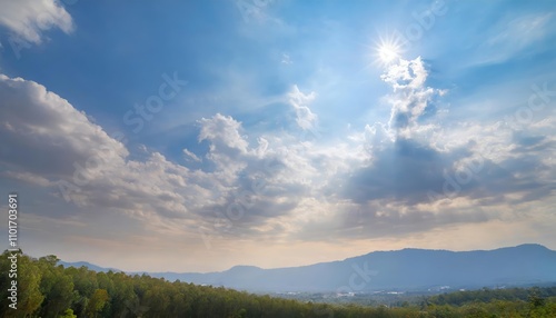 Bright Blue Sky with Sunlight and a Mix of Large and Small Clouds Creating a Stunning Natural Scene of Serene Beauty, Capturing the Vibrant Contrast Between Blue Sky and Cloud Formations.