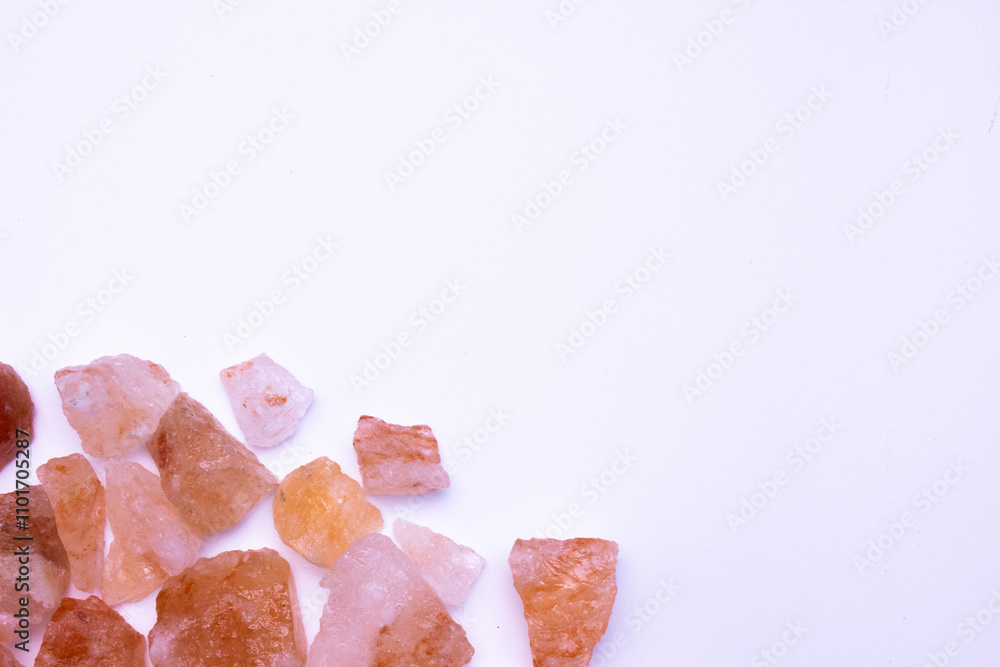 A pile of pink rocks on a white background. The rocks are of different sizes and shapes, and they appear to be arranged in a random pattern. A pile of pink rocks on a white background. The rocks are of different sizes and shapes, and they appear to be arranged in a random pattern.