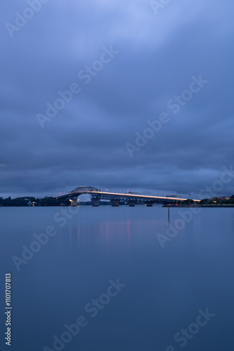 Long exposure of an early morning traffic congestion on Auckland bridge photo