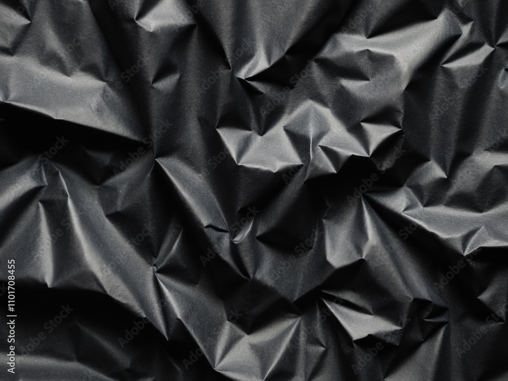 Textured Black Crumpled Paper Background for Abstract Designs. Textured Black Crumpled Paper Background for Abstract Designs.