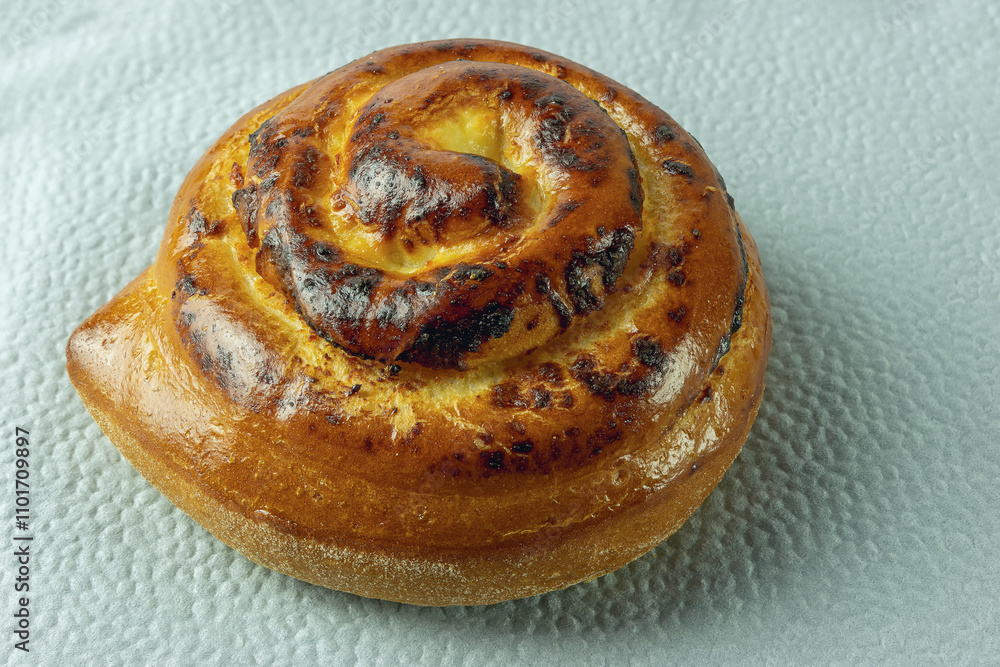 Fototapeta premium Dough bun with cottage cheese filling on a napkin
