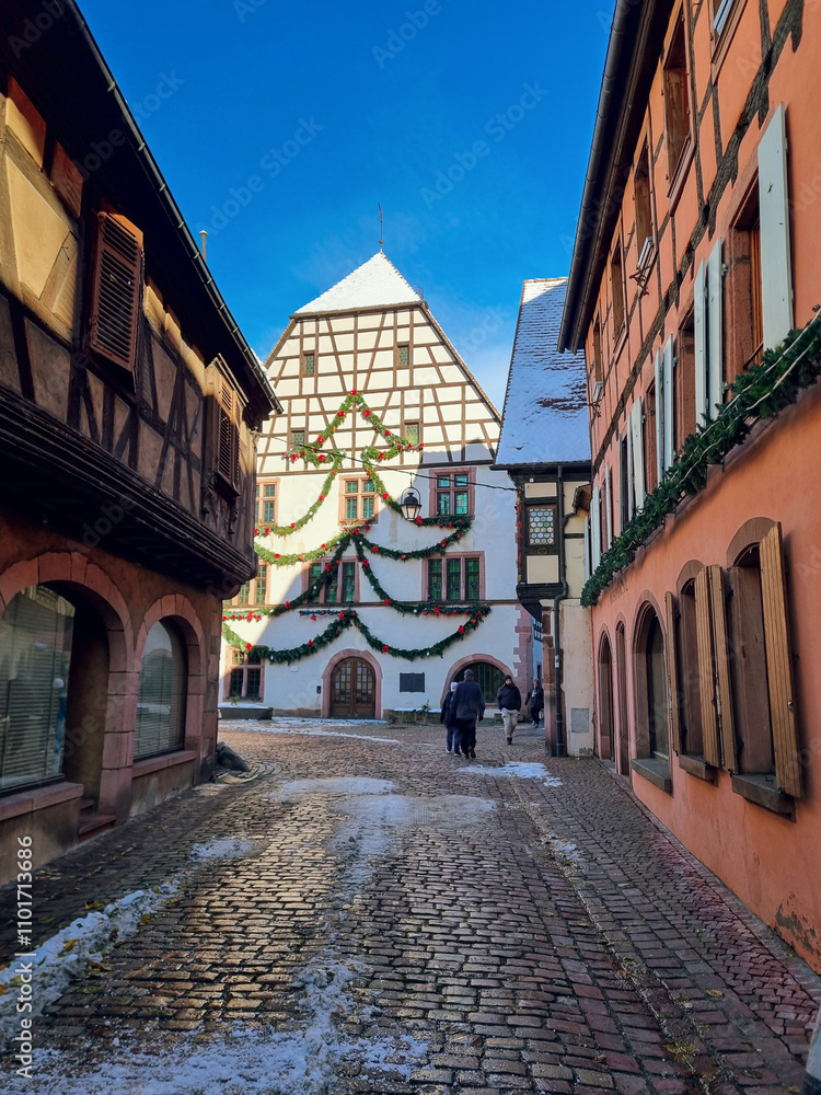 Obraz premium Kaysersberg-Vignoble with Christmas decoration - colorful half-timbered houses in snow, village near Colmar, Alsace Region, France, one of the most charming villages in France, Alsace Wine Route
