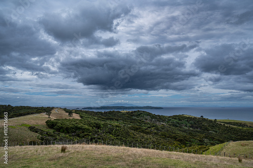 Expansive views on a cloudy day from the Shakespeare Regional Park, Auckland, New Zealand photo