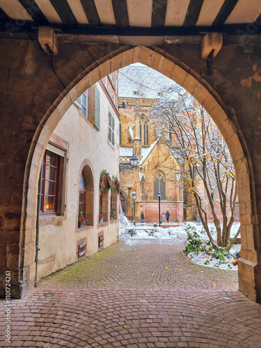 Passage street view to The Église Saint-Martin (St. Martin church) in snow, Colmar cathedral, Christmas mood in November, Colmar, Alsace, France