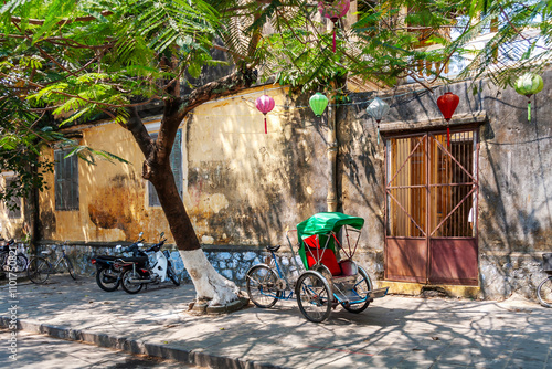 Traditional cyclo parked on the pavement, Hoi An, Vietnam