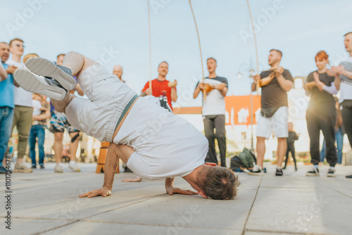 Man dancing capoeira, hanging out, fighting