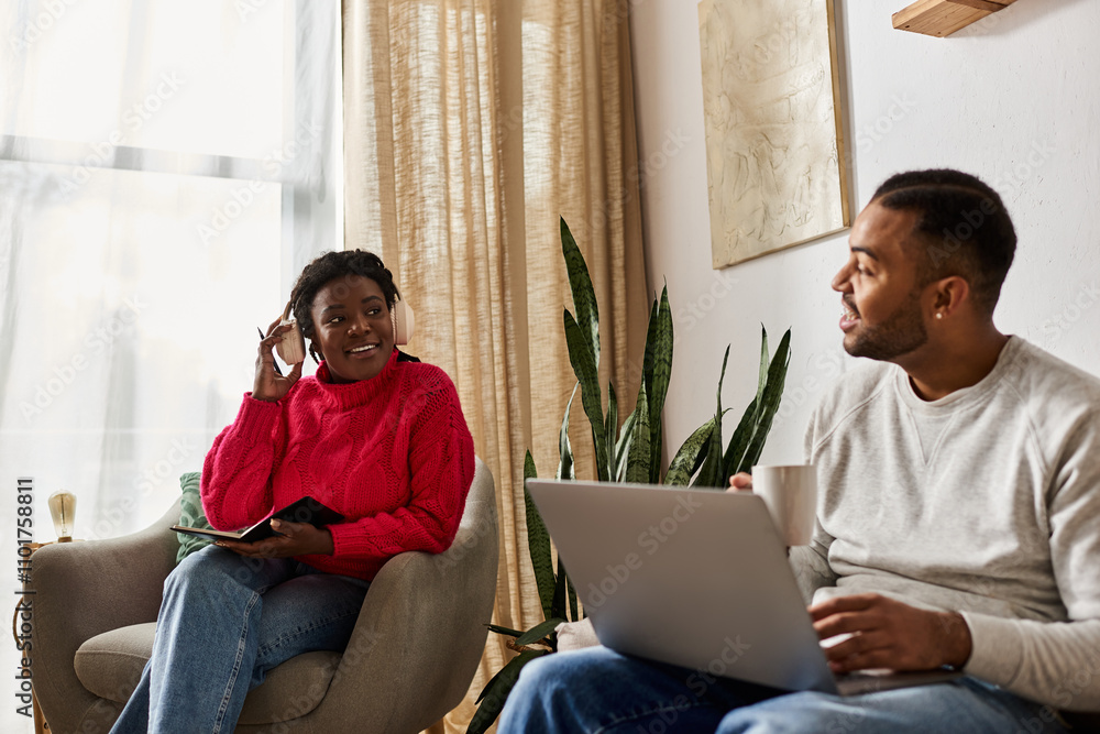 Happy couple enjoys quality time together while sitting comfortably at home during winter. Happy couple enjoys quality time together while sitting comfortably at home during winter.