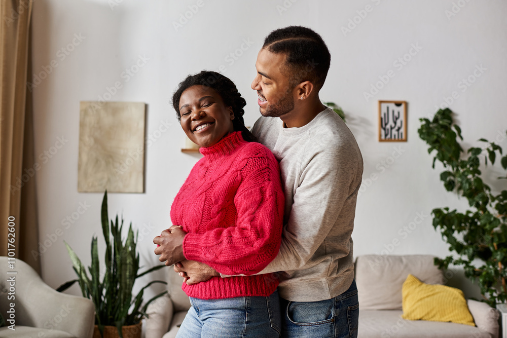 A joyful couple enjoys a loving moment, dressed in cozy sweaters at home during winter. A joyful couple enjoys a loving moment, dressed in cozy sweaters at home during winter.