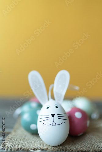 Easter bunny in front of Easter eggs