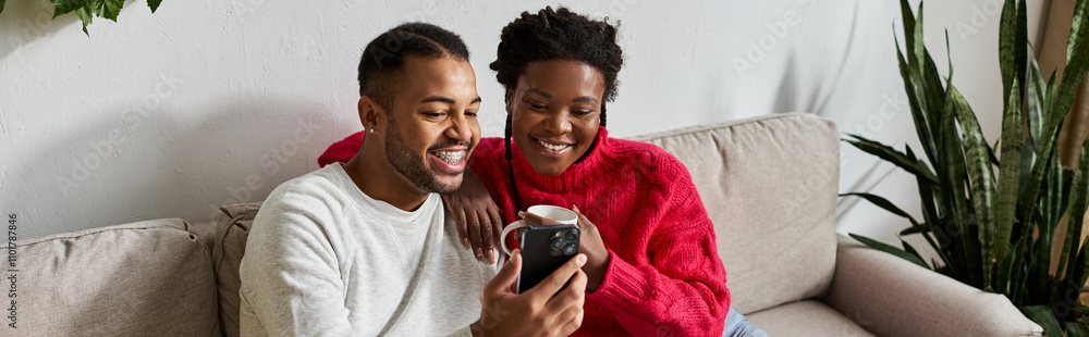 Happy couple snuggles together in their living room, enjoying quality time and warmth. Happy couple snuggles together in their living room, enjoying quality time and warmth.