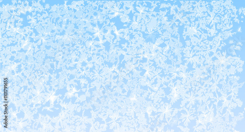 Frozen winter frost background. Abstract icy pattern in white and blue color. Frost-covered glass texture on a chilly winter morning