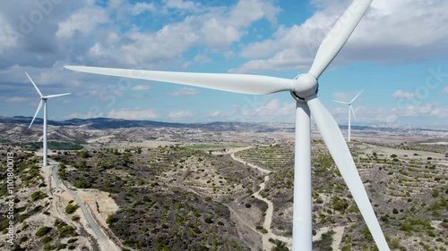 Aerial View of Wind Turbines in Scenic Mountain Landscape drone footage