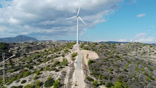 Aerial View of Wind Turbines in Scenic Mountain Landscape drone footage